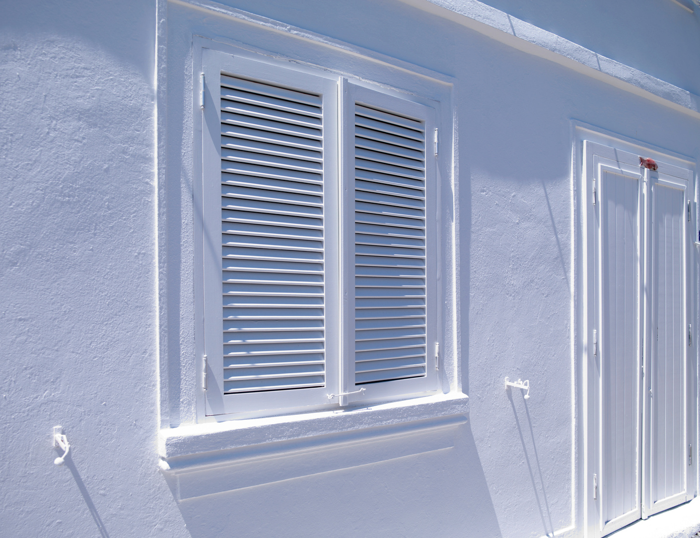 White painted house shutters