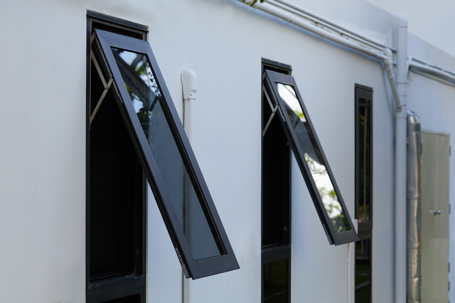 Black frame aluminum windows of building.