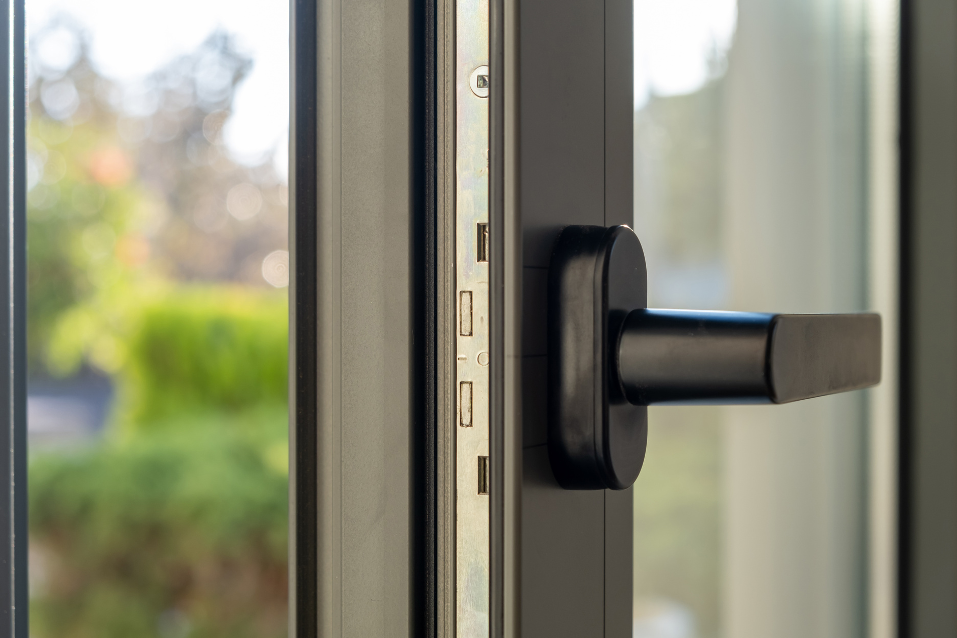 Close up of aluminum door window, blurry background